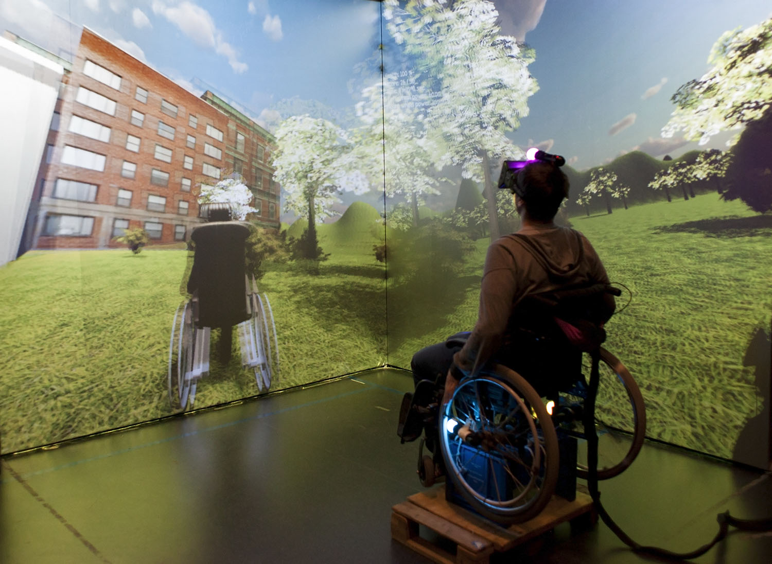 An empowering first-person game using Oculus Rift, where the player controls a wheelchair by spinning wheels that have PS Move controllers attached to them.