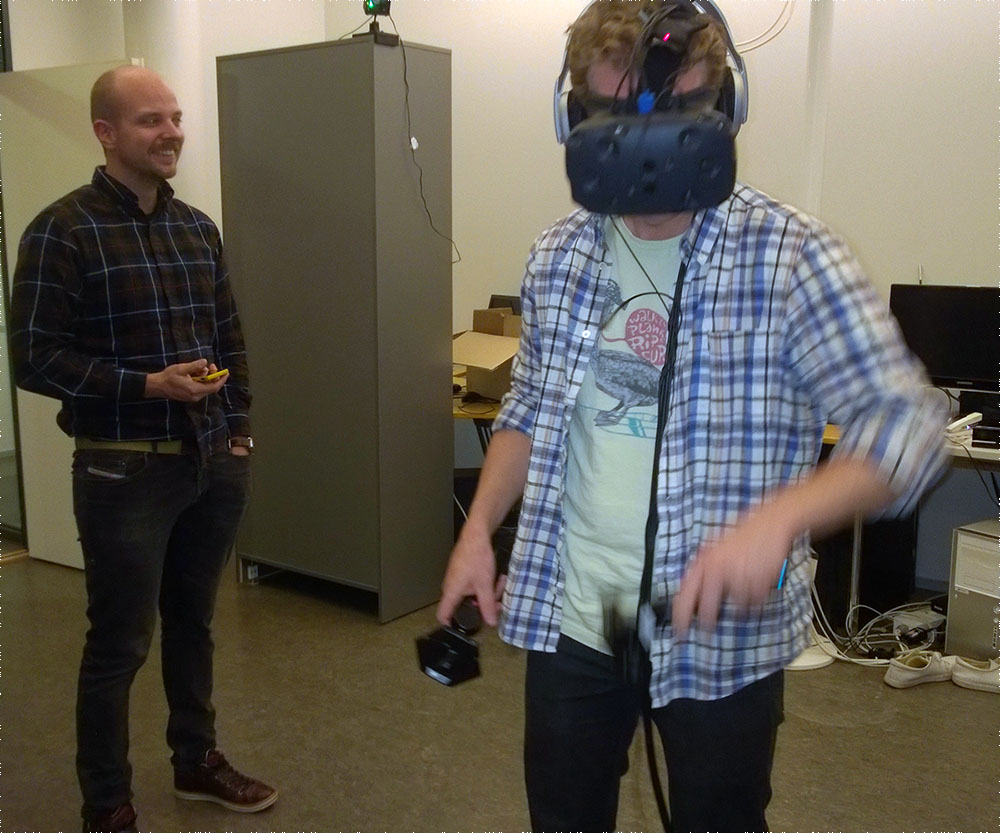 Aalto University researchers trying out HTC Vive for the first time